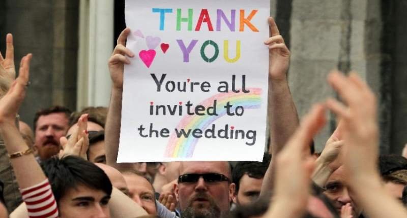 Revelers-hoist-a-celebratory-sign-after-Irelands-marriage-referendum-passed-resoundingly-on-May-23-2015-AFP-800x430