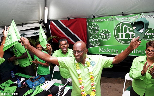 On the most wanted list: Disgraced former FIFA vice-president Jack Warner parties with supporters after his release on bail. He handed himself into authorities after he was named in an FBI indictment last week on charges of soliciting bribes
