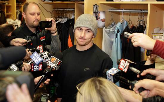 FILE - In this Monday, Dec. 29, 2014, file photo, Cleveland Browns quarterback Johnny Manziel talks with the media at the NFL football team's training camp, in Berea, Ohio. An advisor for Manziel said in a statement released by the team Monday, Feb. 2, 2015, that Manziel has decided to enter treatment for an unspecified condition. (AP Photo/Tony Dejak, File)